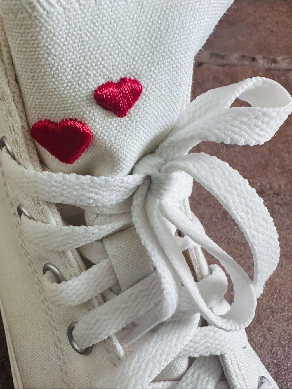 Converse White High-Top Sneakers with Pink Accents